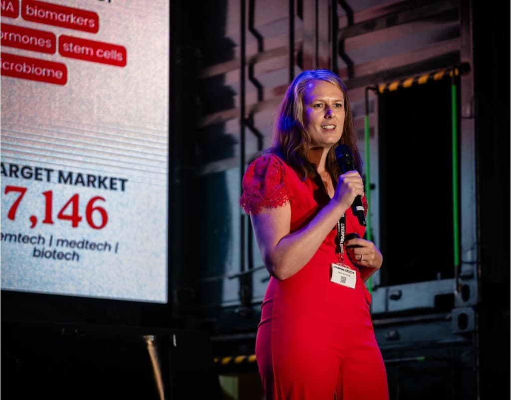 Karli presenting femtech research on stage