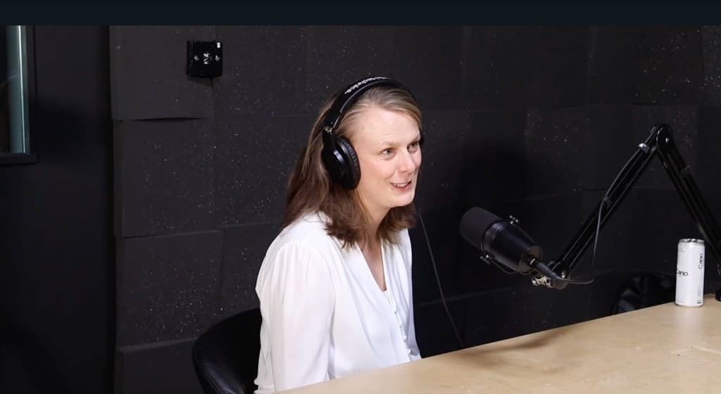 Karli recording a podcast in a studio